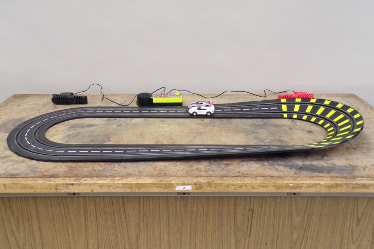 Toy car on banked curve