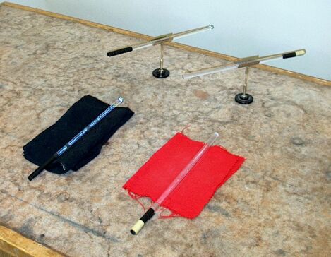 Electrostatically charged rods Electrostatically charged rods