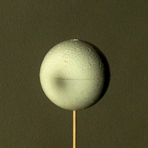 Close-up of solar eclipse, room darkened